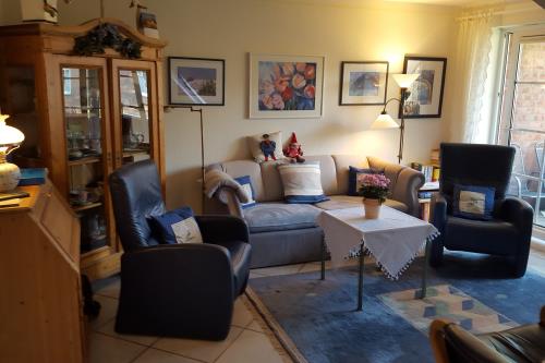 Spiekeroog Ferienwohnung Wes blied - Sei glücklich - Wohnzimmer unten
