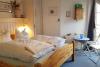 Spiekeroog Ferienwohnung Wes blied - Sei glücklich - Schlafzimmer unten